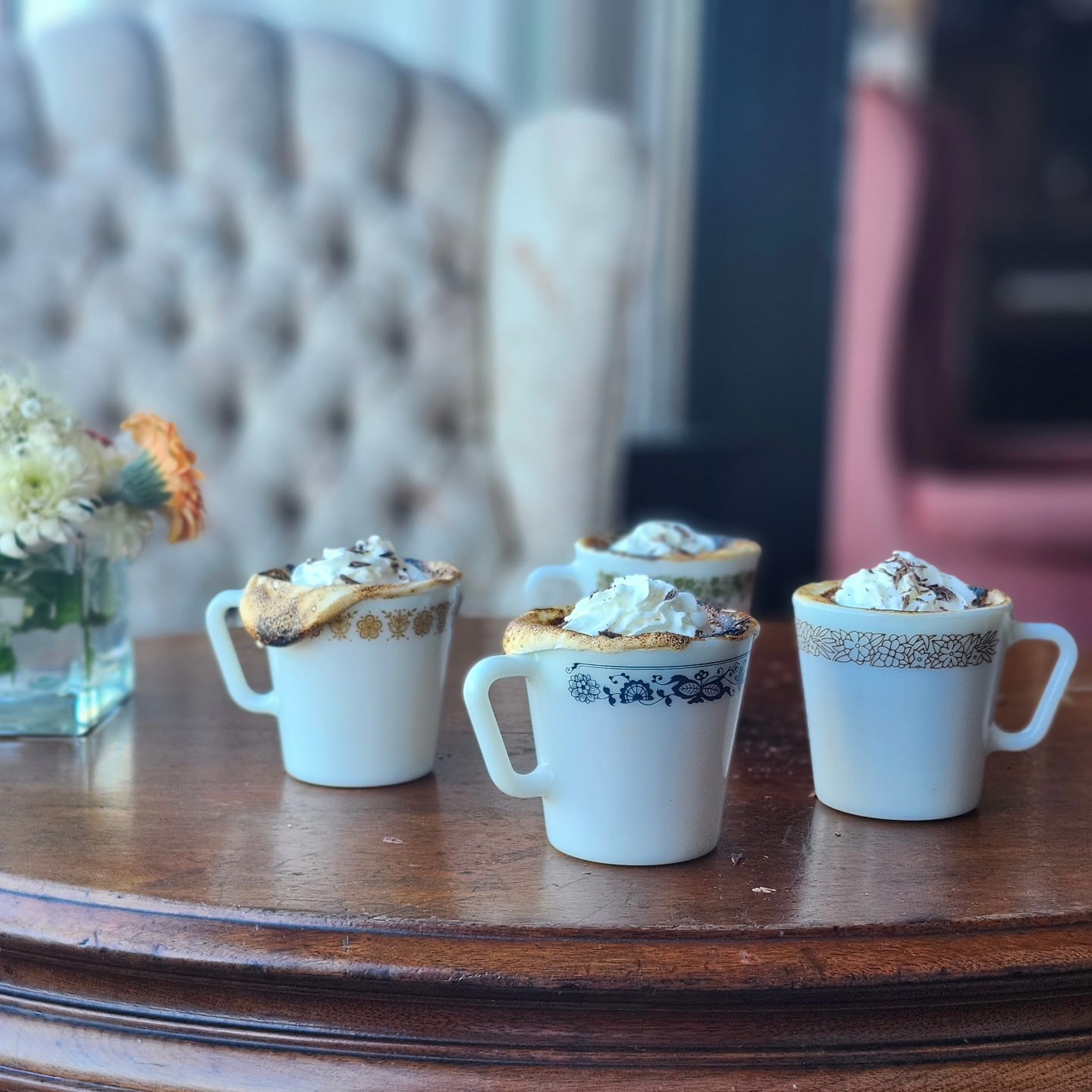 Toasted-marshmallow hot chocolate in vintage cups along the Hot Chocolate Trail