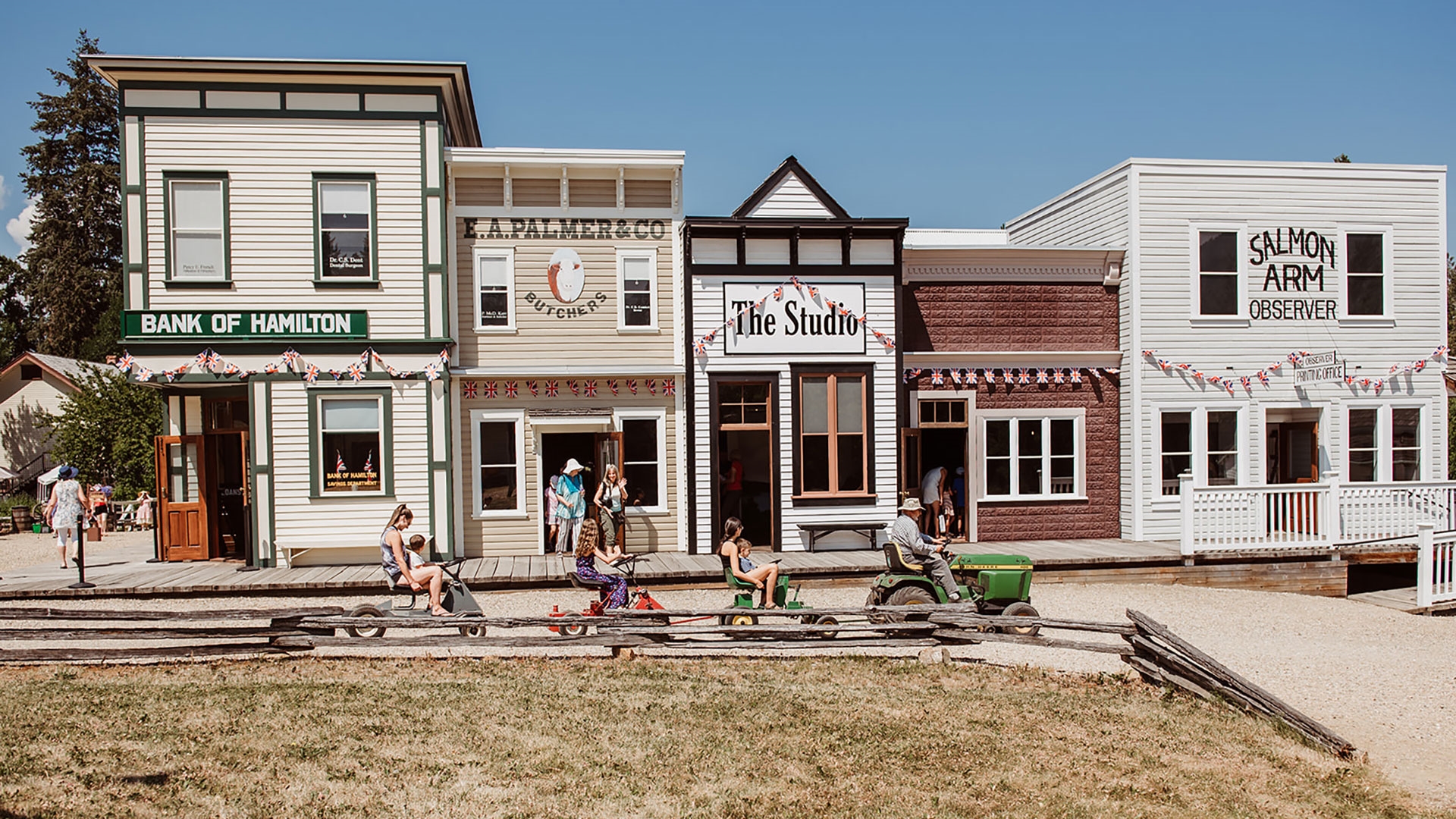 Historic storefronts and costumed interpreters at RJ Haney Heritage Village